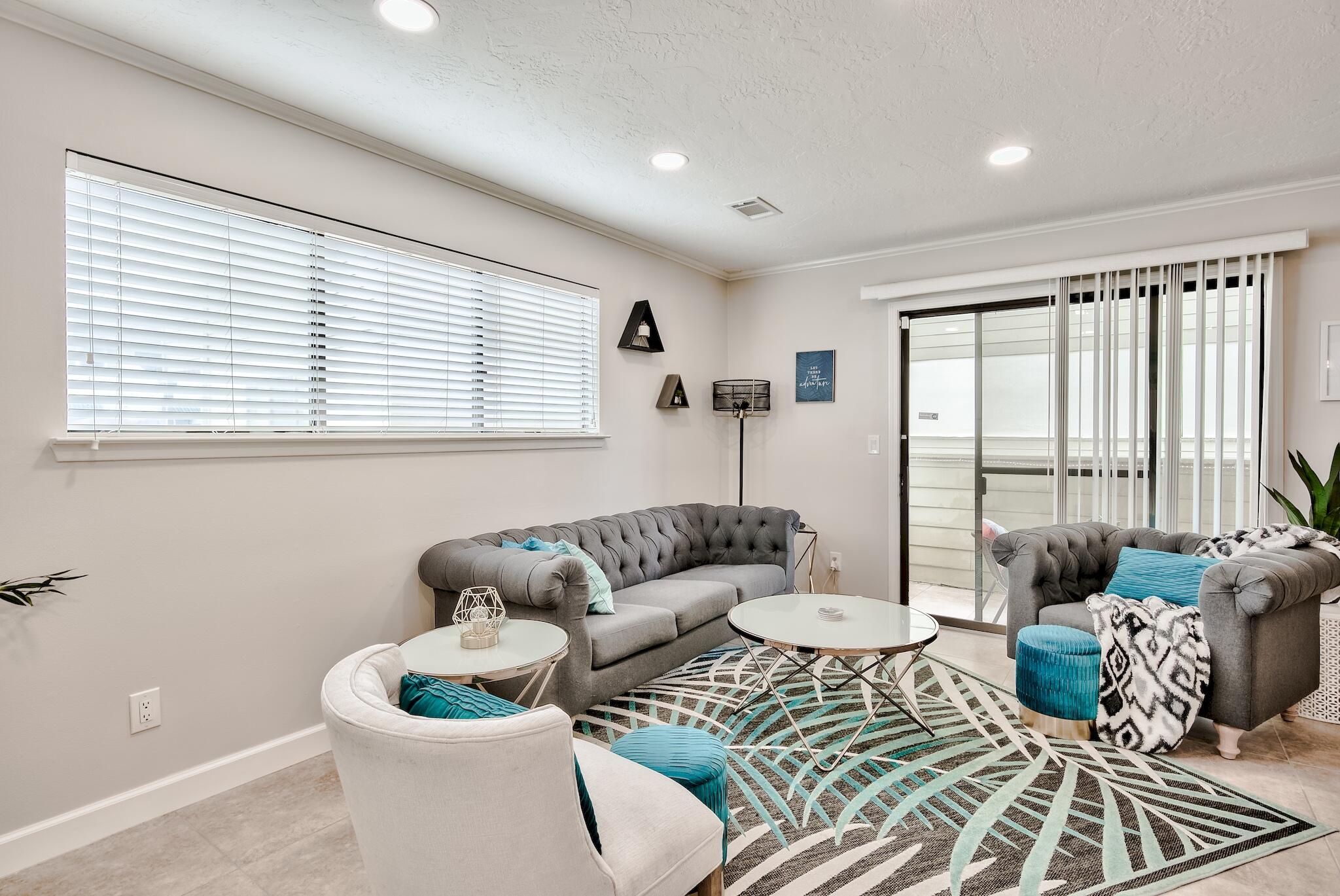 64 Cross Creek Road, Unit 11 Miramar Beach, FL 32550 - Photo 2 of 20 a living room with furniture and a large window