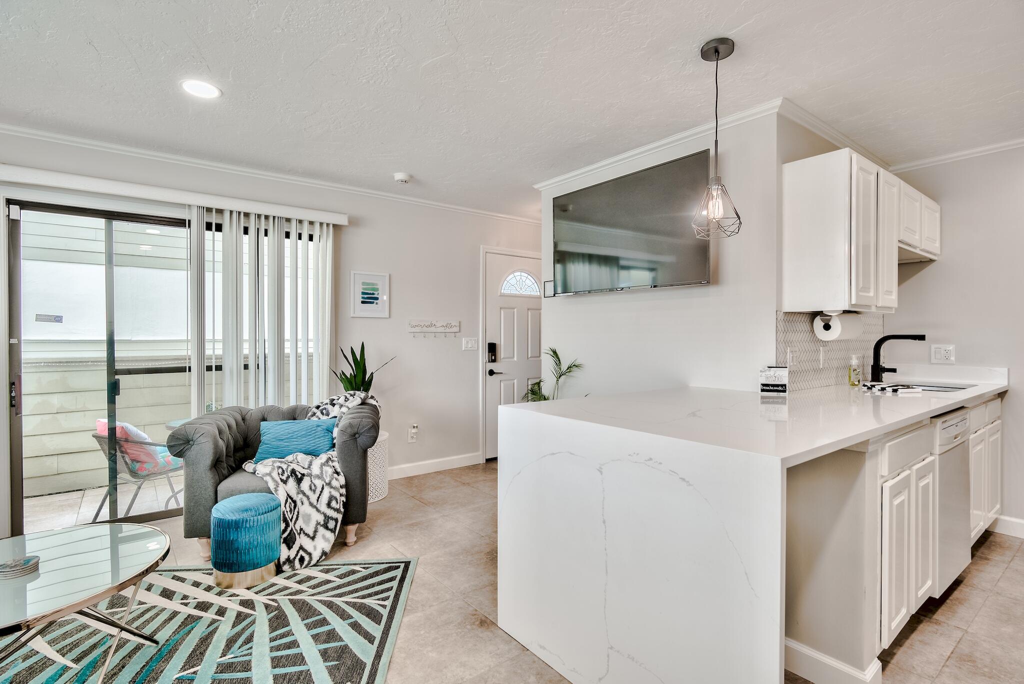 64 Cross Creek Road, Unit 11 Miramar Beach, FL 32550 - Photo 4 of 20 a living room with furniture and a flat screen tv