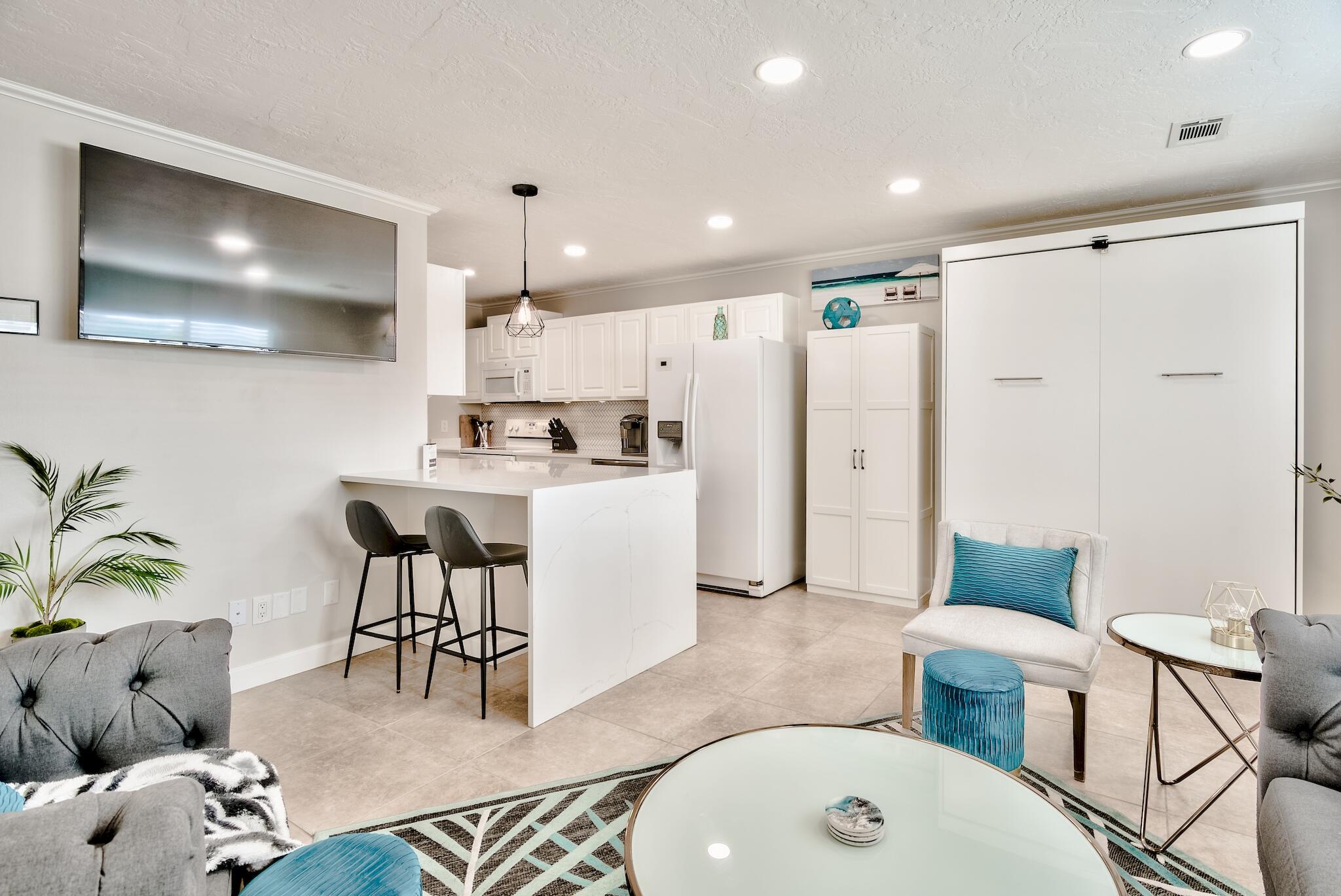 64 Cross Creek Road, Unit 11 Miramar Beach, FL 32550 - Photo 6 of 20 a living room with furniture and a flat screen tv