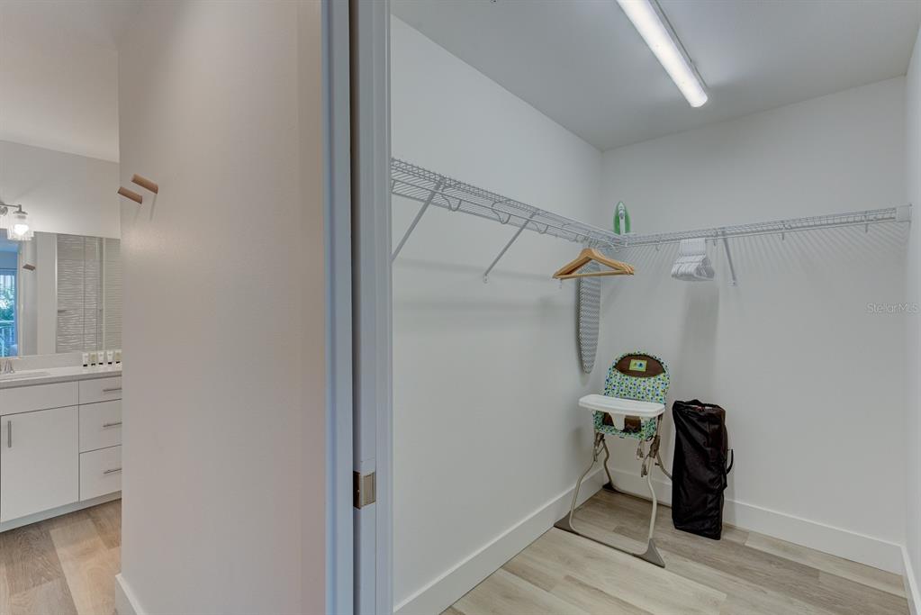 15305 1st Street East, Unit 202 Madeira Beach, FL 33708 - Photo 18 of 40 a view of hallway with wooden floor