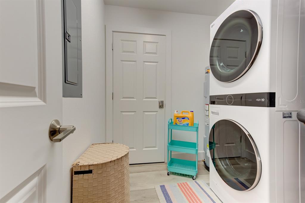 15305 1st Street East, Unit 202 Madeira Beach, FL 33708 - Photo 30 of 40 a utility room with dryer and washer