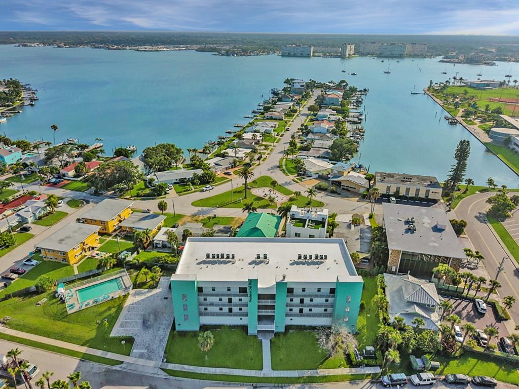 15305 1st Street East, Unit 202 Madeira Beach, FL 33708 - Photo 34 of 40 an aerial view of a house with a lake view