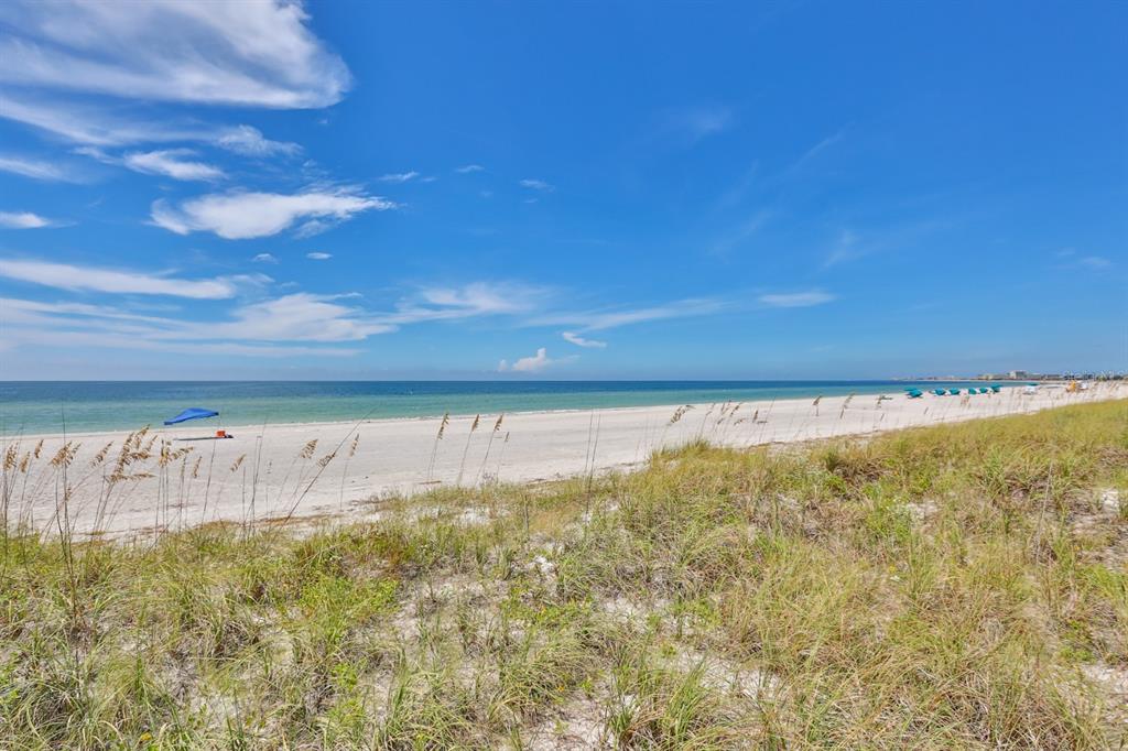 15305 1st Street East, Unit 202 Madeira Beach, FL 33708 - Photo 39 of 40 a view of an ocean from a balcony