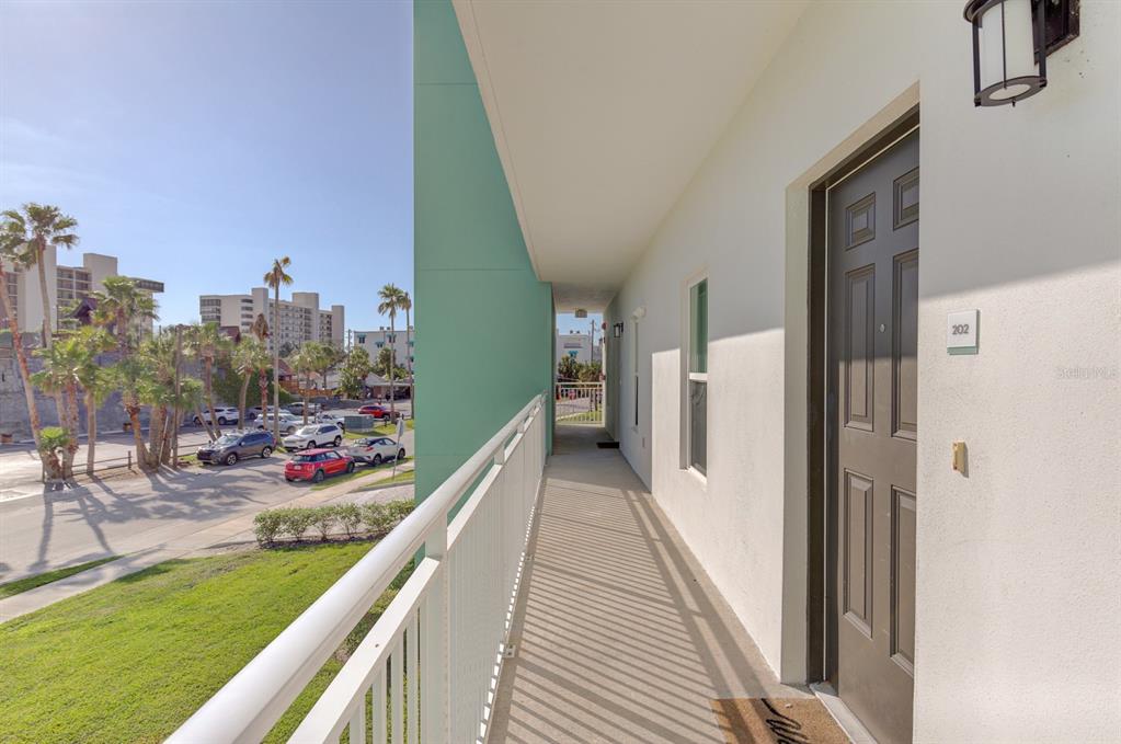 15305 1st Street East, Unit 202 Madeira Beach, FL 33708 - Photo 4 of 40 a view of a balcony with an outdoor space