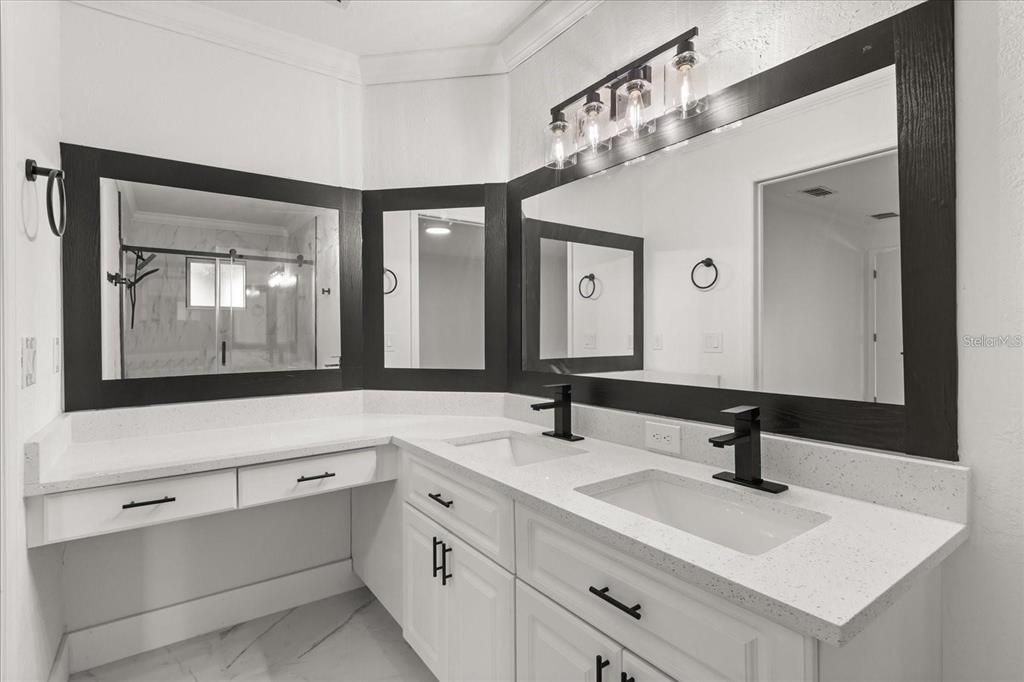 6027 Southwest 98th Street Road Ocala, FL 34476 - Photo 21 of 44 a bathroom with a sink and a mirror