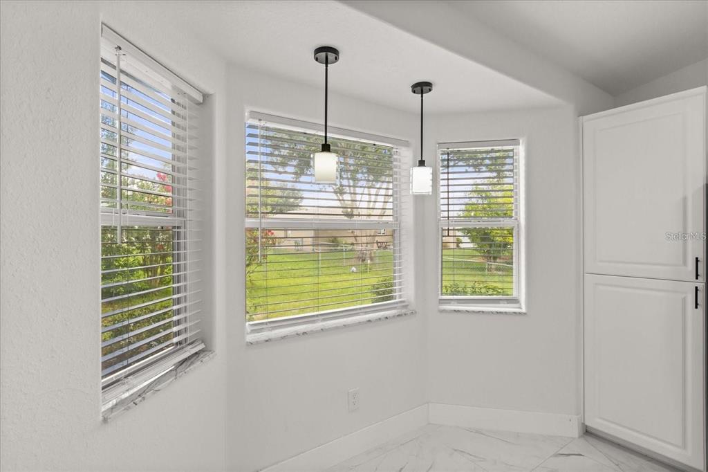 6027 Southwest 98th Street Road Ocala, FL 34476 - Photo 6 of 44 a view of an empty room with windows