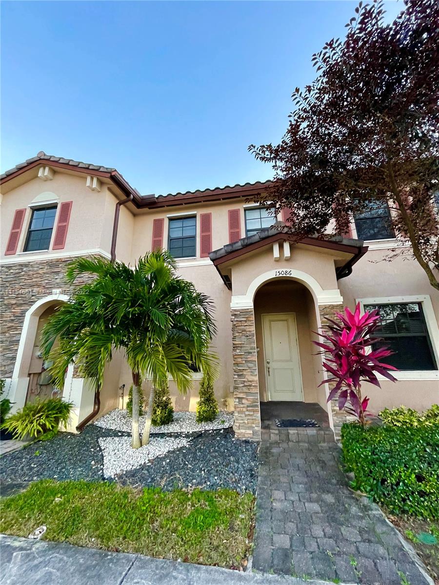 a front view of a house with yard
