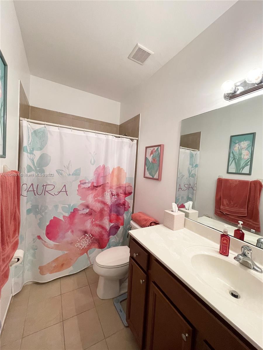 15086 Southwest 116th Street Miami, FL 33196 - Photo 13 of 19 a bathroom with a sink toilet and shower