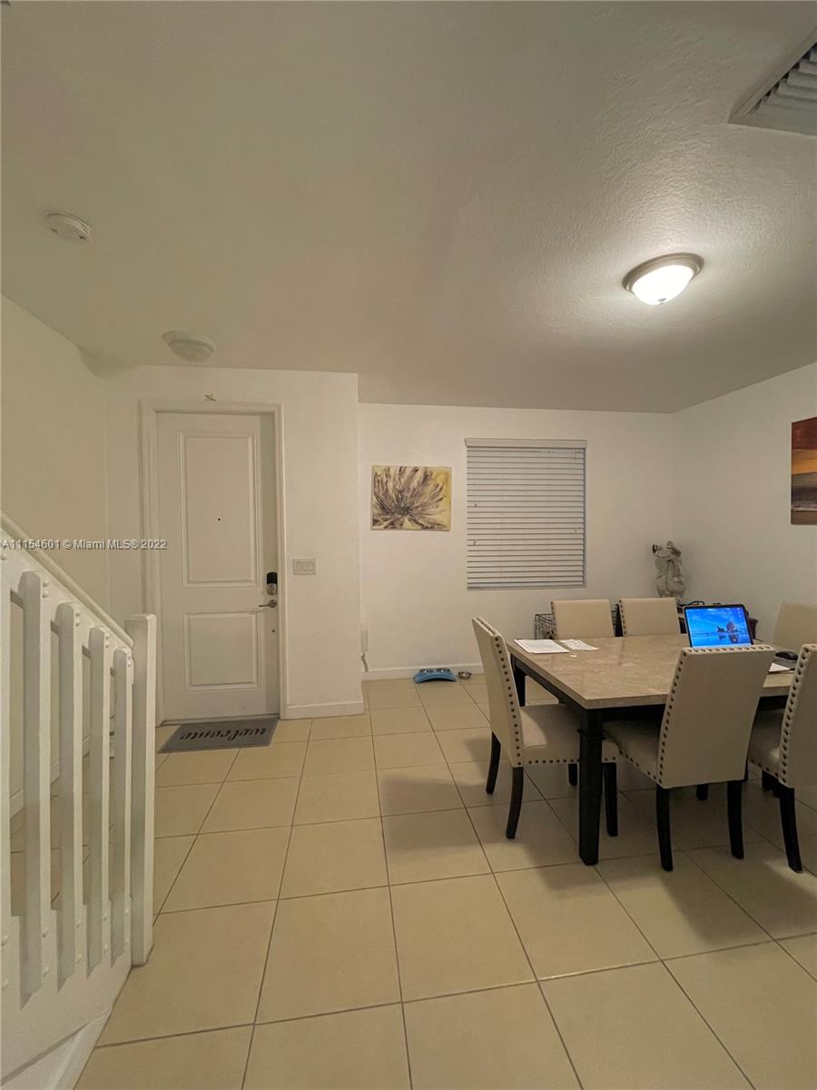 15086 Southwest 116th Street Miami, FL 33196 - Photo 8 of 19 a workspace with furniture and window