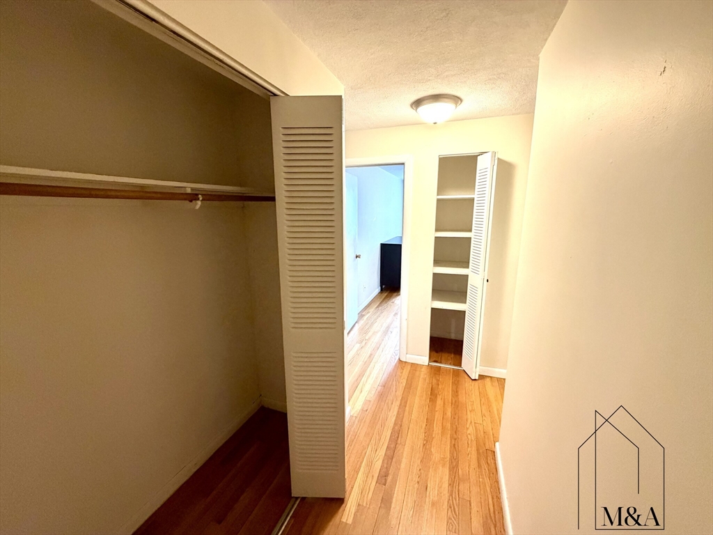 197 Kent Street, Unit 15 Brookline, MA 02446 - Photo 9 of 10 a view of walk in closet with empty space