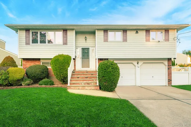 a view of house with backyard