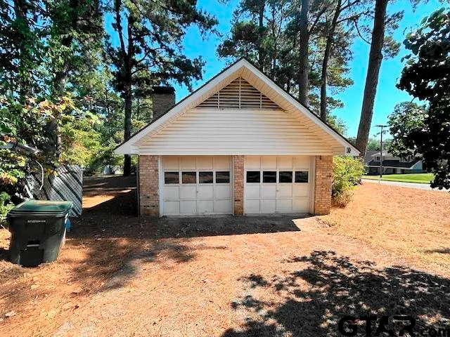 a view of a house with a yard covered in snow