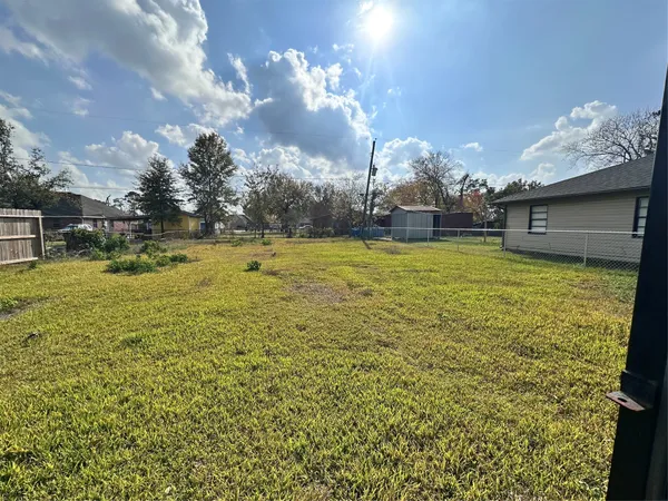 a view of a water fountain in an empty room with floor to ceiling window