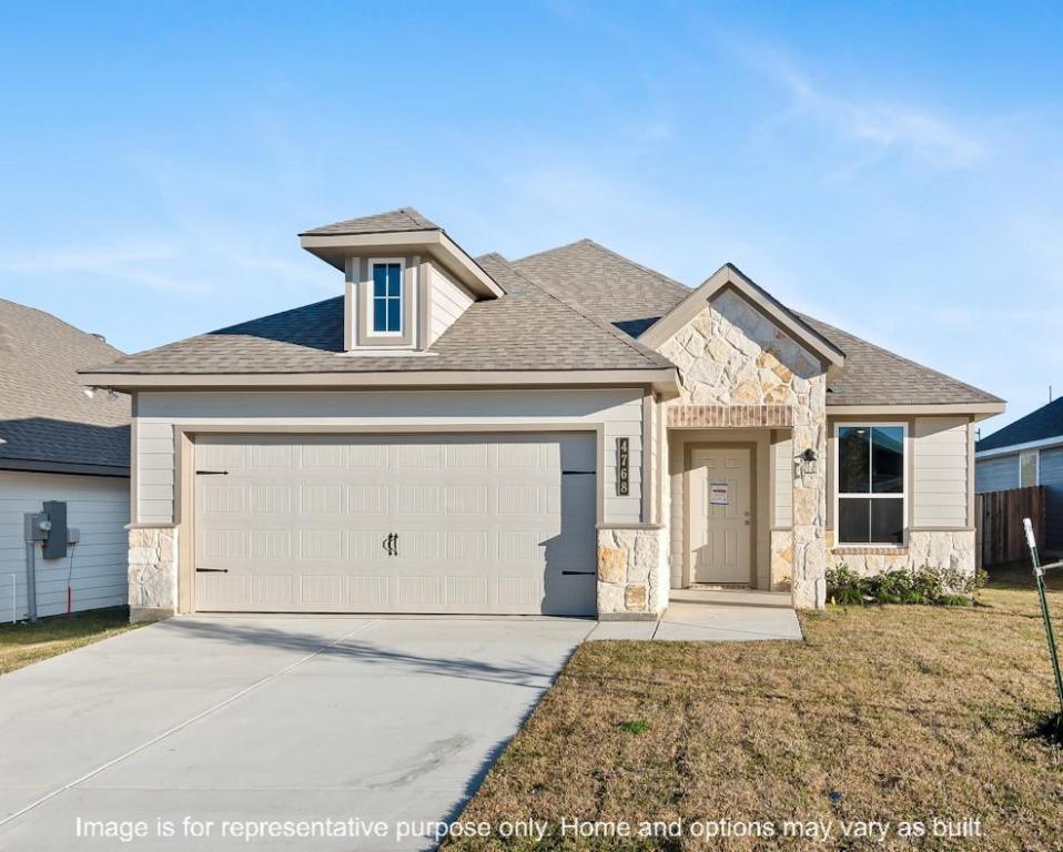4787 Holm Oak Road Bryan, TX 77845 - Photo 3 of 12 a front view of a house with a garage