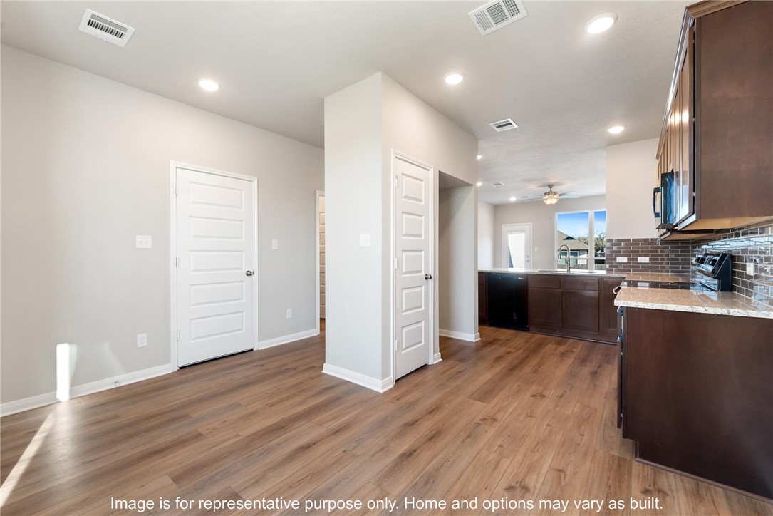 4787 Holm Oak Road Bryan, TX 77845 - Photo 4 of 12 a view of kitchen with wooden floor