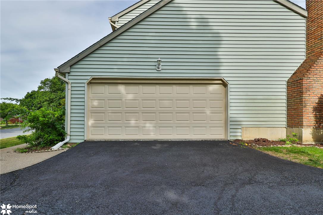 4059 Wedgewood Road Allentown, PA 18104 - Photo 6 of 72 A well-maintained garage door and driveway offer convenient access to this charming residence.