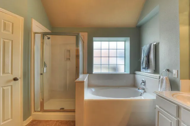 a kitchen with a cabinets and chandelier