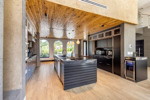 a bathroom with a glass shower door and a toilet
