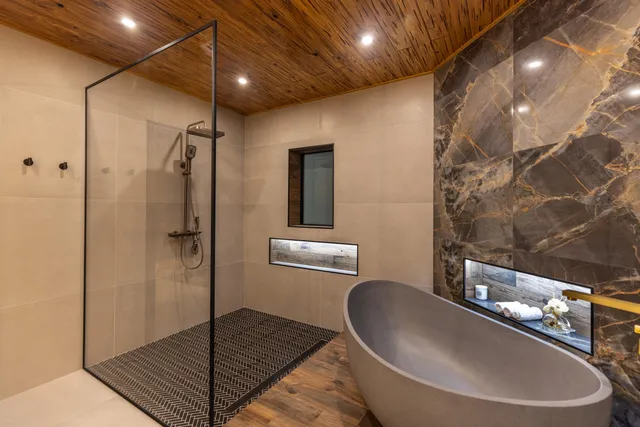 a view of a building with sitting area and garden