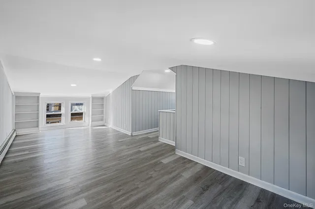 a view of a livingroom with wooden floor