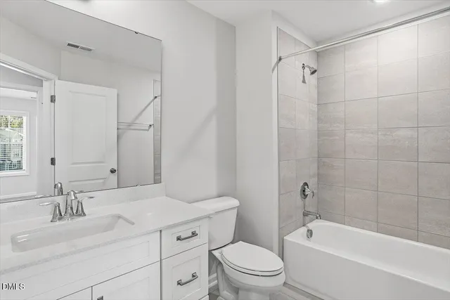 a bathroom with a sink a toilet and a bathtub