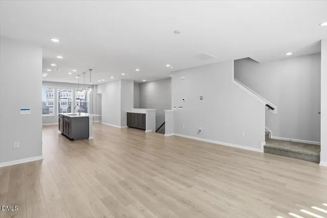 a view of a kitchen with a sink and a large window
