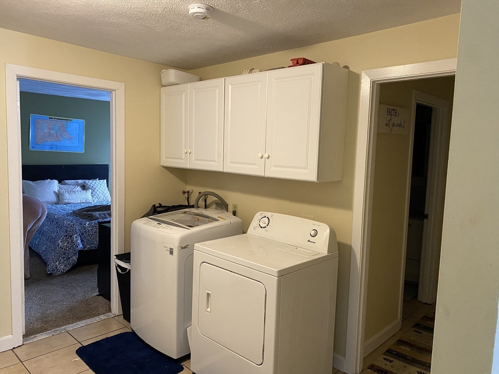 133 Walnut Street, Unit 2 Malden, MA 02148 - Photo 5 of 10 a utility room with dryer and washer
