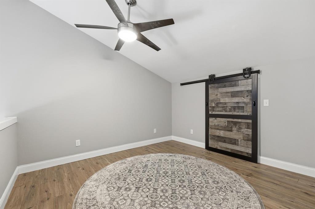 7366 Point Aquarius Quinlan, TX 75474 - Photo 16 of 30 an empty room with a dresser