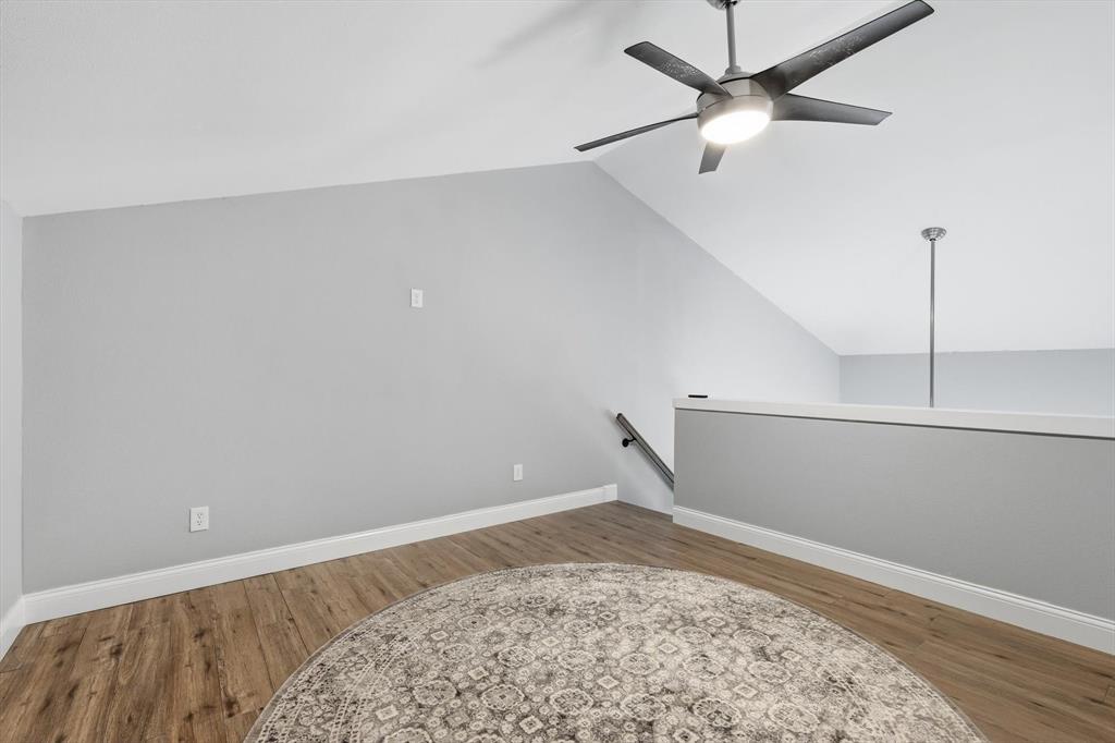 7366 Point Aquarius Quinlan, TX 75474 - Photo 17 of 30 a view of a room with a bed and wooden floor