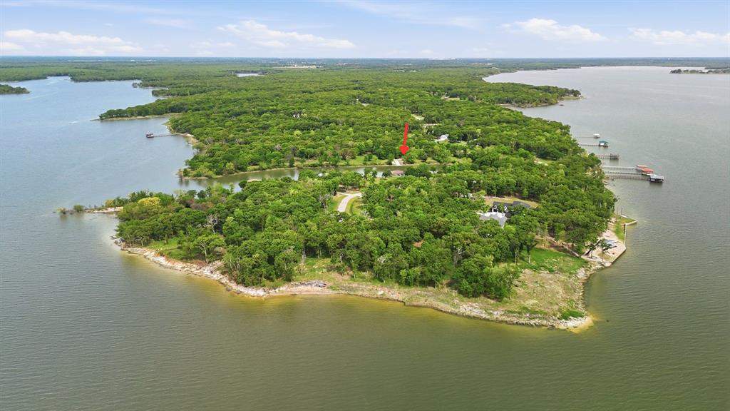 7366 Point Aquarius Quinlan, TX 75474 - Photo 18 of 30 a view of a lake with a yard