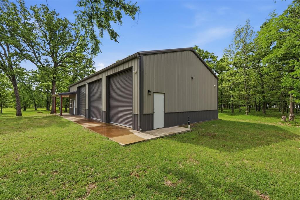 7366 Point Aquarius Quinlan, TX 75474 - Photo 21 of 30 a view of backyard with garden