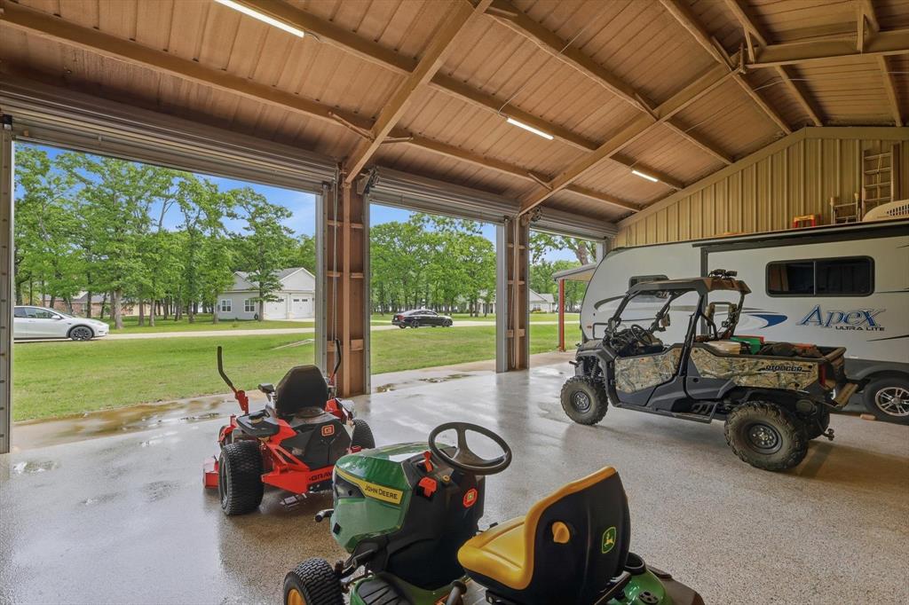 7366 Point Aquarius Quinlan, TX 75474 - Photo 25 of 30 a view of a swimming pool and lounge chairs in patio with a yard