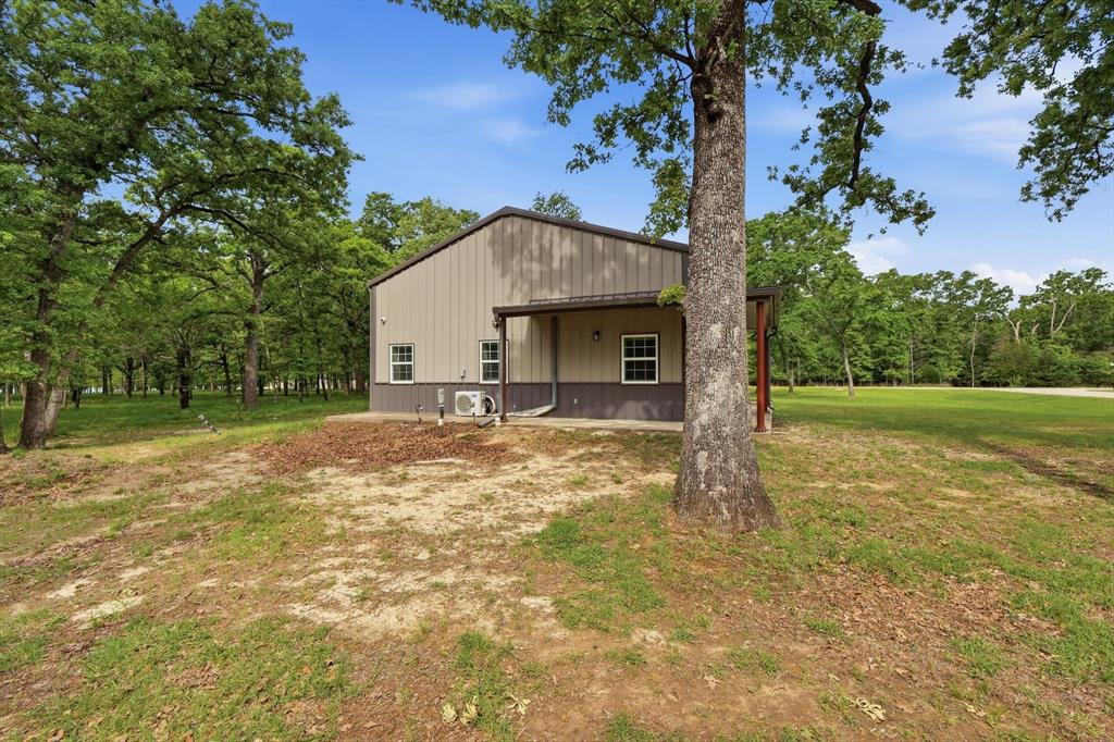 7366 Point Aquarius Quinlan, TX 75474 - Photo 27 of 30 a view of a house with a yard