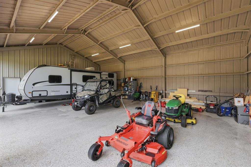 7366 Point Aquarius Quinlan, TX 75474 - Photo 7 of 30 a view of parking garage with cars