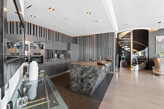 a view of a living room with furniture and a floor to ceiling window