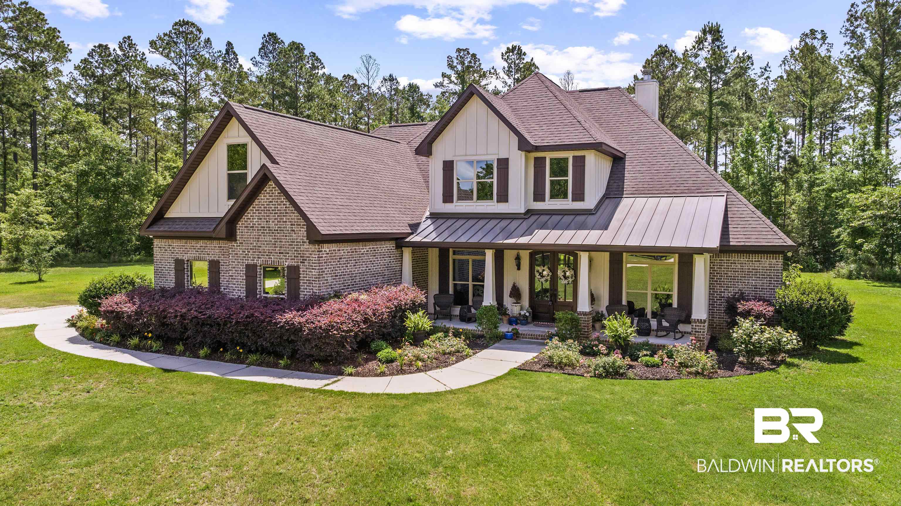 36784 Legacy Way Bay Minette, AL 36507 - Photo 57 of 57 View of front of home with board and batten siding, brick siding, a porch, a standing seam roof, and a front yard