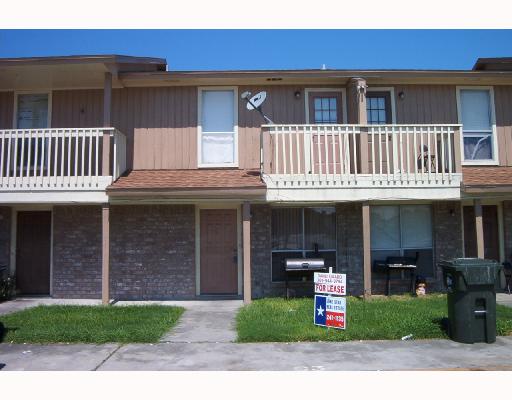4820 Delwood Street, Unit C 3 Corpus Christi, TX 78413 - Photo 1 of 6 a front view of a house with a yard