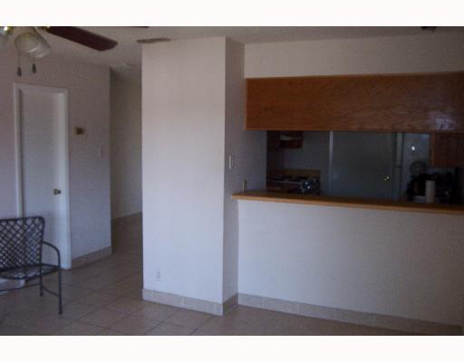 4820 Delwood Street, Unit C 3 Corpus Christi, TX 78413 - Photo 2 of 6 a living room with furniture and a fireplace