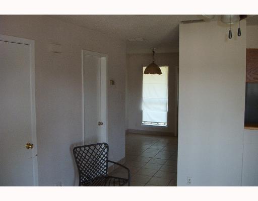 4820 Delwood Street, Unit C 3 Corpus Christi, TX 78413 - Photo 4 of 6 a view of an empty room and window