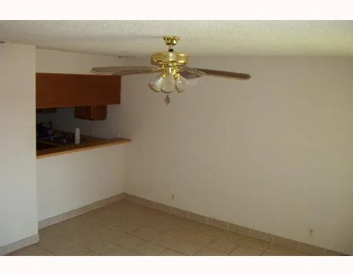 a picture of a room with a fan