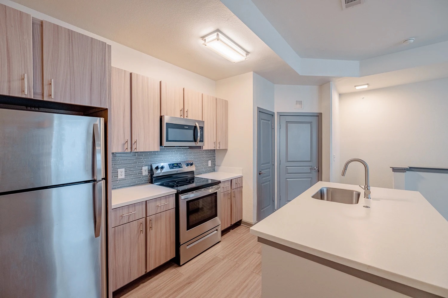 8515 Interstate 35, Unit 16218 Austin, TX 78744 - Photo 14 of 19 a kitchen with a refrigerator sink and stove