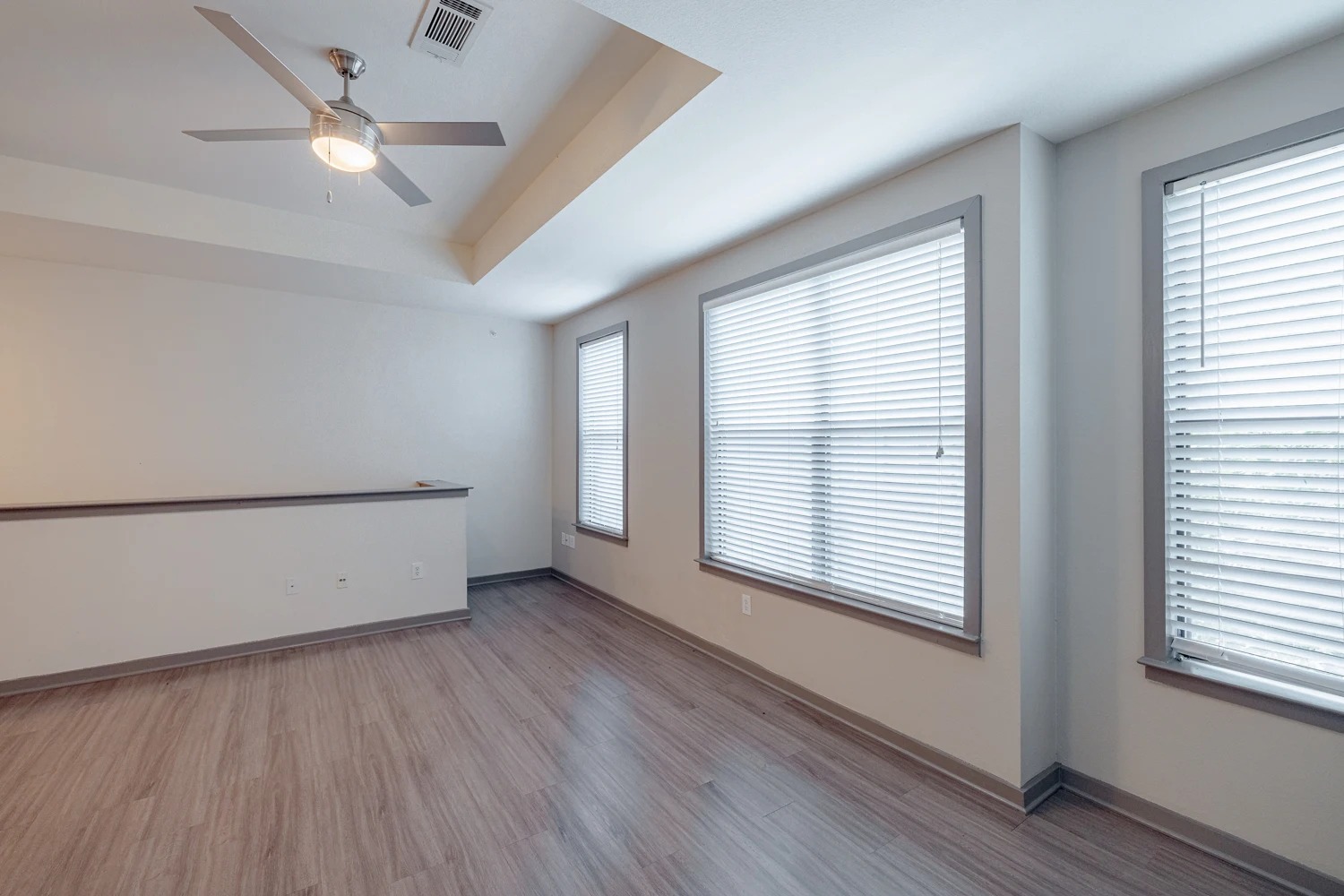 8515 Interstate 35, Unit 16218 Austin, TX 78744 - Photo 17 of 19 a view of an empty room with wooden floor and a window