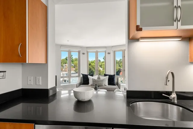 a kitchen with a sink and a window