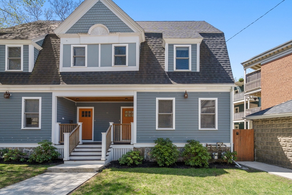 91 Glen Road, Unit 2 Boston, MA 02130 - Photo 1 of 31 a front view of a house with a yard