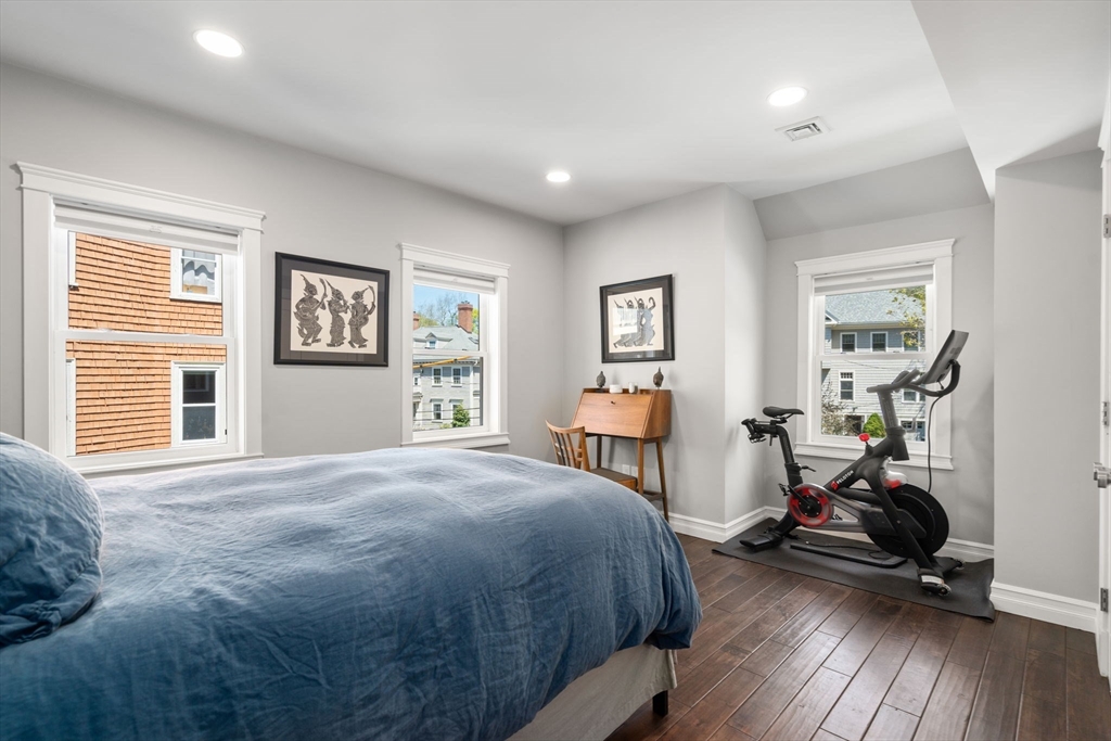 91 Glen Road, Unit 2 Boston, MA 02130 - Photo 11 of 31 a view of a bedroom with furniture and a window