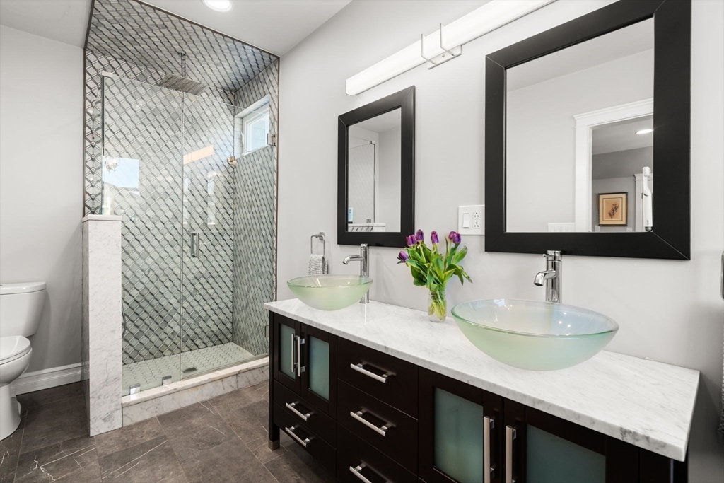 91 Glen Road, Unit 2 Boston, MA 02130 - Photo 16 of 31 a bathroom with a sink and a mirror