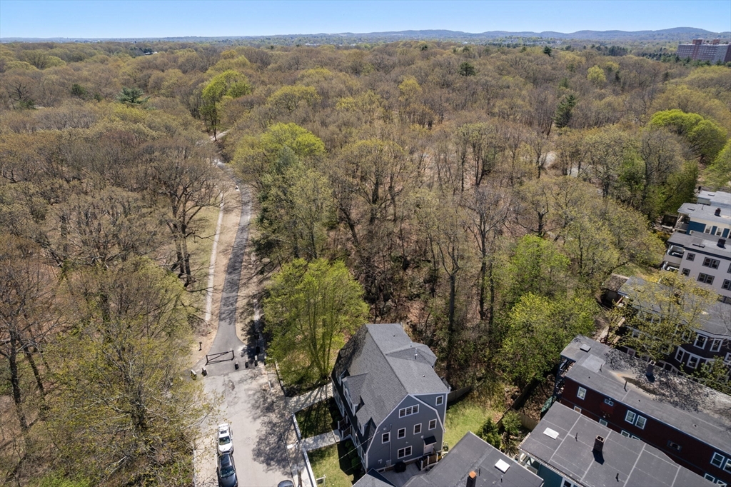 91 Glen Road, Unit 2 Boston, MA 02130 - Photo 28 of 31 an aerial view of a houses with a yard
