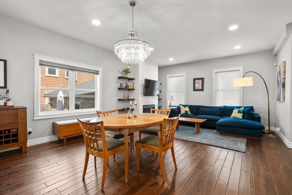 91 Glen Road, Unit 2 Boston, MA 02130 - Photo 8 of 31 a view of a dining room with furniture wooden floor and chandelier