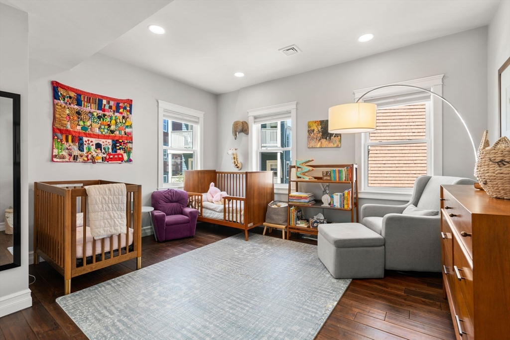 91 Glen Road, Unit 2 Boston, MA 02130 - Photo 10 of 31 a living room with furniture or couch and a bookshelf