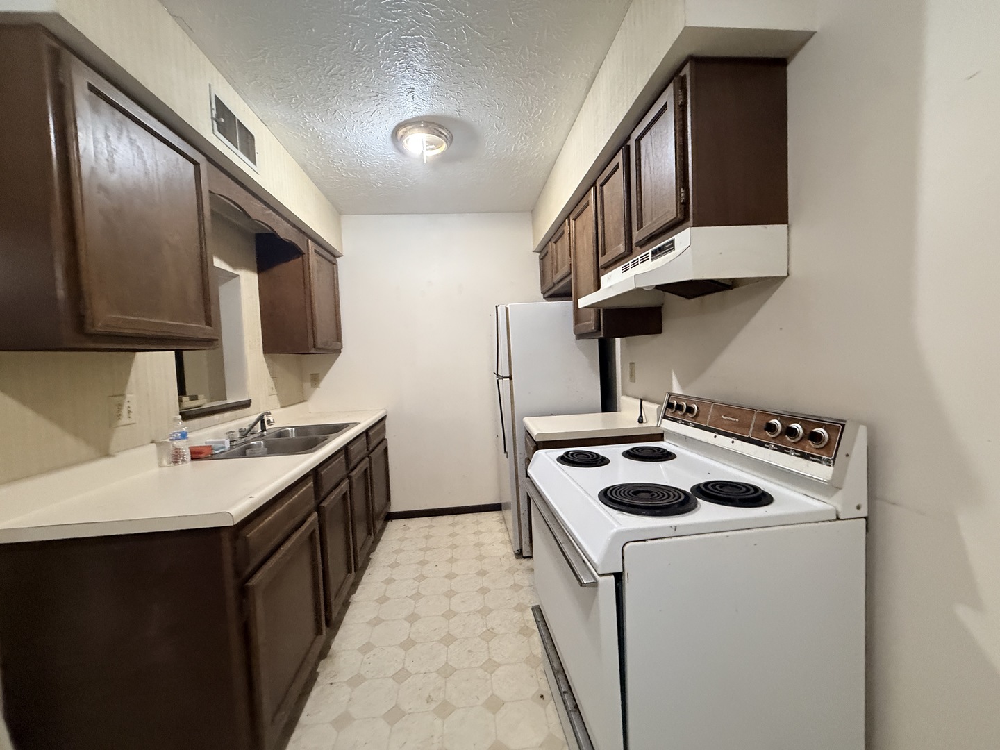 916 South 10th Street Herrin, IL 62948 - Photo 17 of 29 a kitchen with a stove and a sink